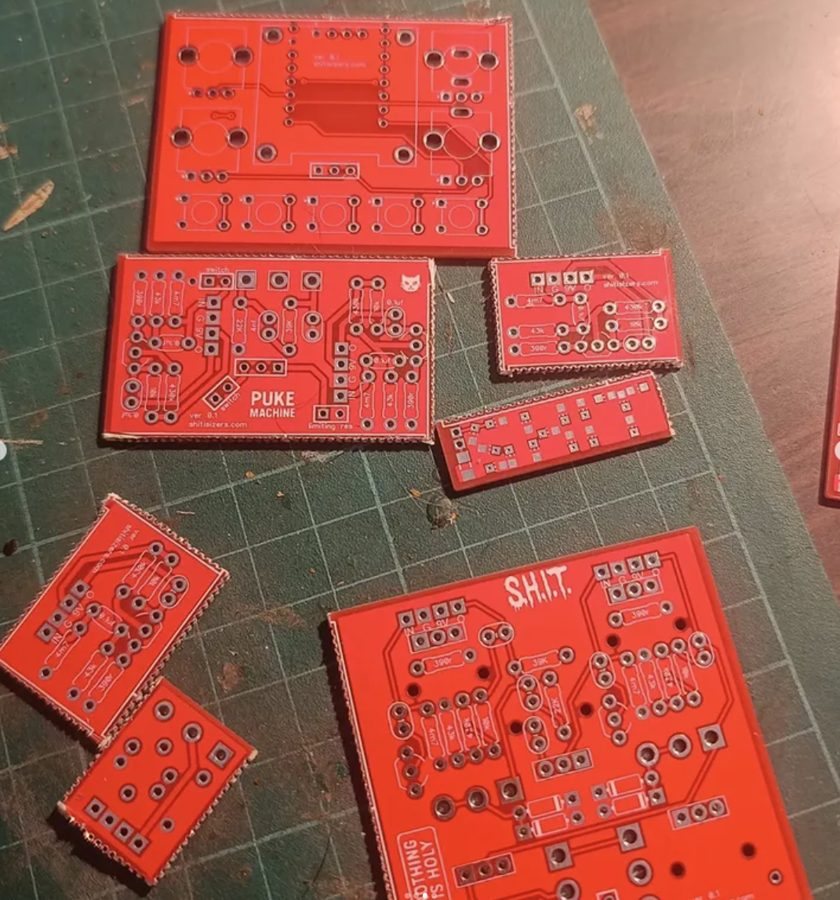 Red circuit boards just back from the fab