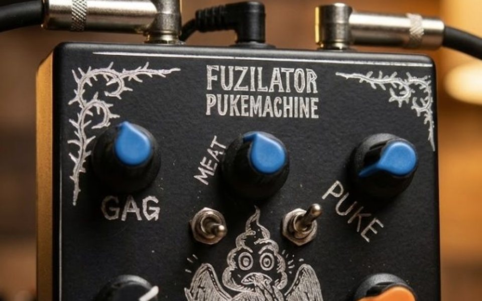 The Fuzilator PukeMachine, a black pedal with a hand-engraved panel